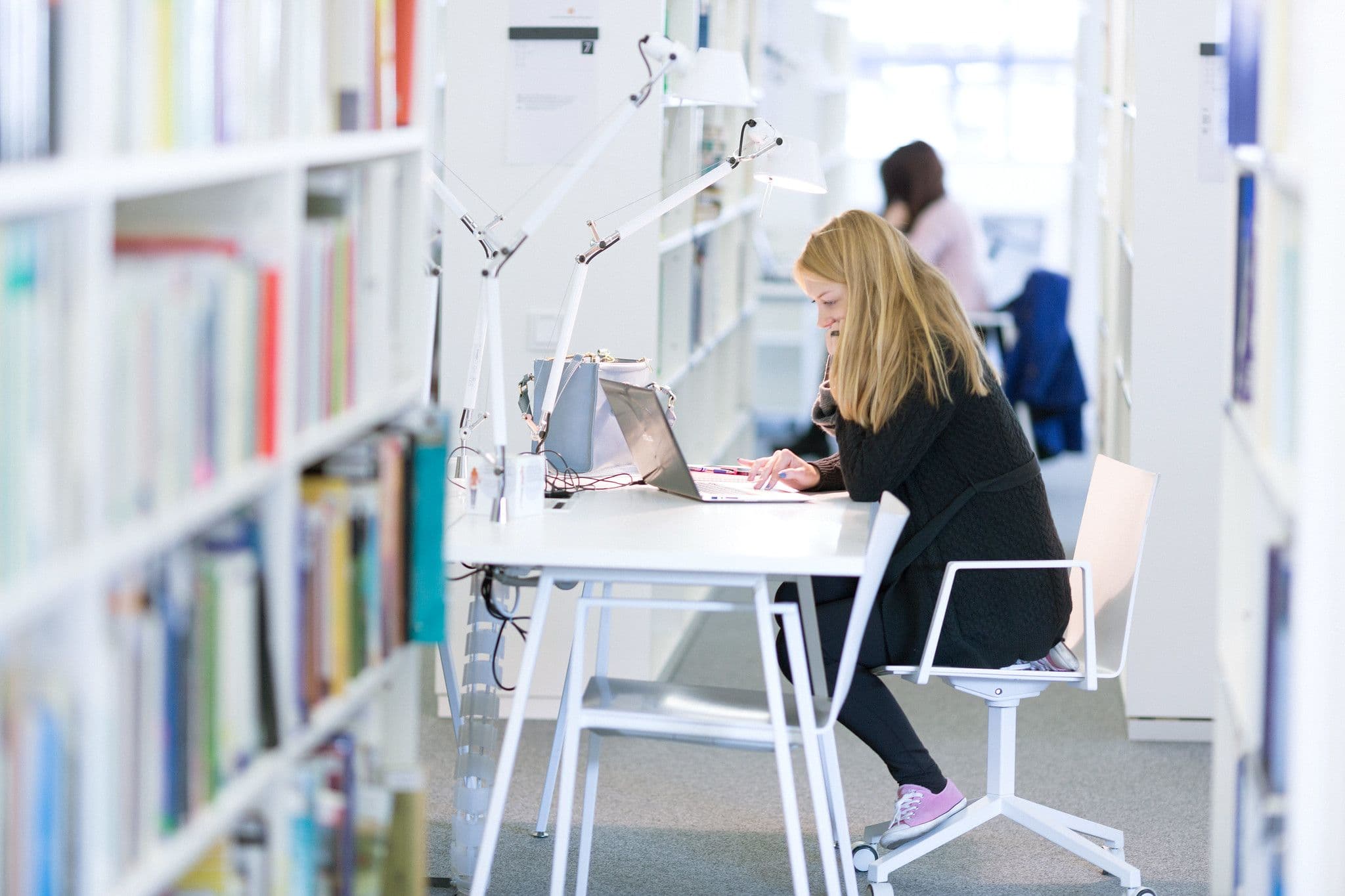Vilnius University student in library